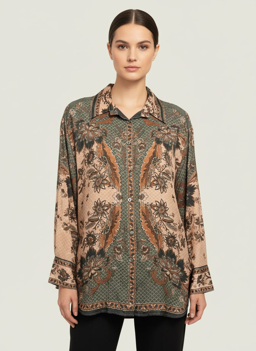 Woman wearing a patterned shirt on a plain background